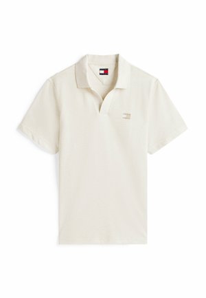 Lichtbeige polo-shirt met een klassieke kraag, korte mouwen en een klein geborduurd logo op de borst. Gemaakt van gestructureerde katoenstof.
