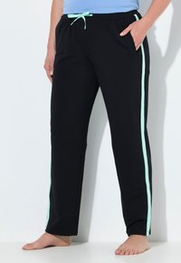 Czarne spodnie dresowe z jasnym miętowym paskiem po bokach, z elastycznym pasem, sznurkiem oraz bocznymi kieszeniami.