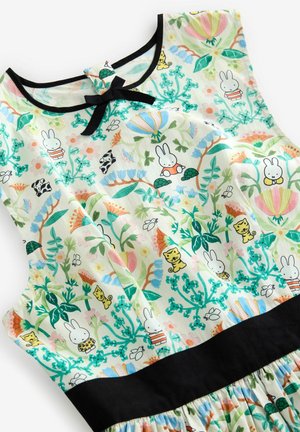 Cotton dress featuring a colorful floral and animal print with a black waistband. The neckline has a black bow detail.