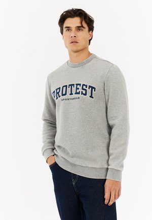 Gray sweatshirt featuring a navy "PROTEST SPORTSWEAR" logo, ribbed cuffs, and crew neckline, made from a soft cotton blend fabric.