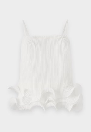 Witte geplooide top met verstelbare bandjes, met een golvende volantszoom en een soepele textuur. Lichte stof met verticale lijnen.