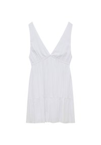 Robe blanche sans manches avec un profond décolleté en V, taille empire, tissu froncé et jupe à étages.