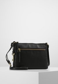 Black leather crossbody bag with a textured surface, featuring a front zipper pocket and gold hardware accents. Adjustable strap included.