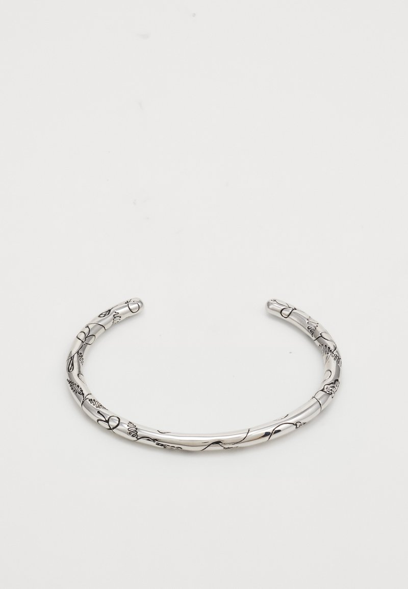 Hõbe käevõru, millel on graveeritud lillemotiivid, sile pind ja avatud otsad. Kerge, intricate detailidega ümber käevõru.