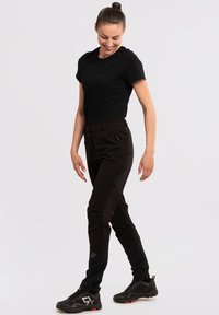 Rukka HIGHWAIST WARM - Friluftsbyxor - schwarz