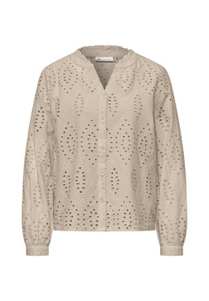 Beżowa bluzka z długim rękawem, z zapięciem na guziki z przodu, wzorami z wycięciami i małym, marszczonym kołnierzykiem.