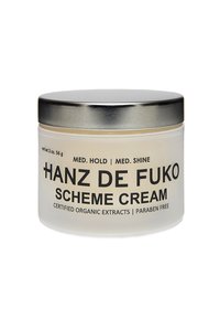 Clear glass jar with a silver metal lid, labeled "Hanz de Fuko Scheme Cream," contains a light cream. Net weight: 2 oz. Paraben free.