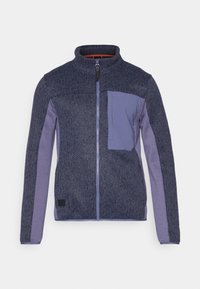 Veste zippée bleu marine avec un corps en tricot texturé et des manches lisses violettes. Dispose d'une poche poitrine et d'un col montant. Étiquette noire à l'ourlet.