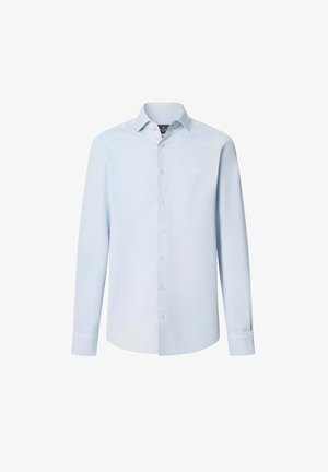 Chemise à manches longues bleu clair boutonnée en coton. Elle possède un col classique, des boutons sur le devant et un petit logo brodé sur la poitrine.