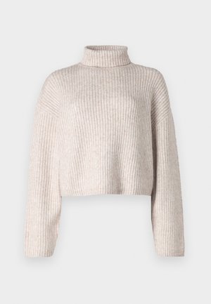 Krems krēmveida ribota džemperis ar augstu apkakli, īsām rokām un garām piedurknēm. Maiga tekstūra, viegla auduma un minimāls dizains.