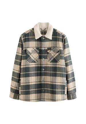 Kariertes Hemdjacke in Beige und Marineblau, mit einem weißen, fleecegefütterten Kragen, zwei Brusttaschen und Druckknopfverschluss. Aus weichem Material gefertigt.