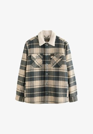 Beige és tengerészkék kockás ingdzseki, fehér bolyhos gallérral, két mellzsebbel és patentos záródással. Puha anyagból készült.