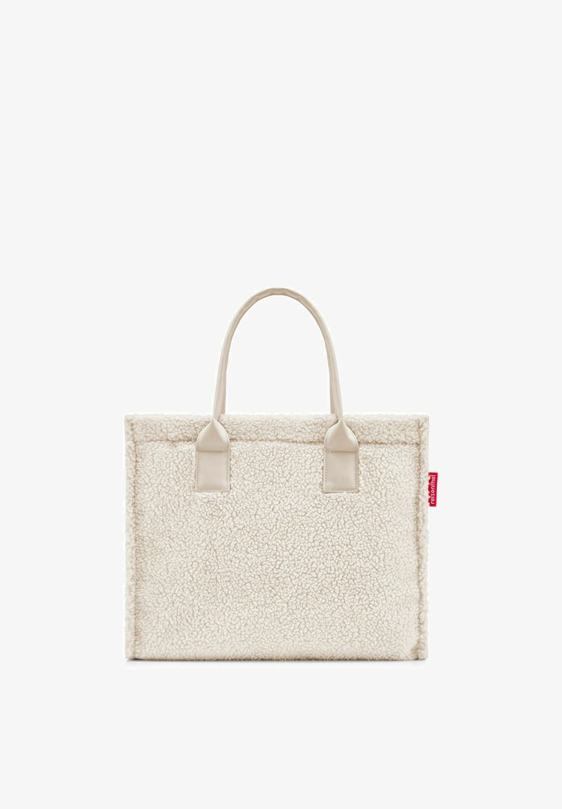 White, textured tote bag with plush exterior and beige handles. Features rectangular shape and minimal branding tag on the side.