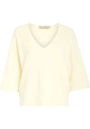 Lichtgele gebreide top met een V-hals, korte mouwen en een ontspannen pasvorm. Kenmerkt zich door een soepele textuur en minimale stikdetails.