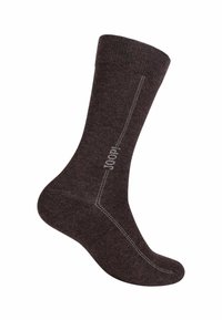 Calzino marrone con una texture morbida, caratterizzato da un logo grigio chiaro e cuciture lungo il lato, che si restringe alla punta e al tallone per adattarsi.