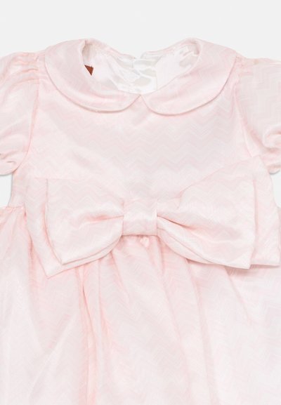 Light pink dress with a chevron pattern, short puff sleeves, a rounded collar, and a large bow at the waist. Soft, shiny fabric texture.
