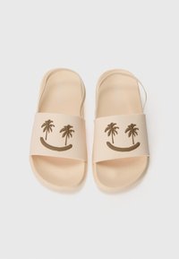 Infradito beige con una finitura testurizzata, caratterizzati da un design con faccina sorridente e palme marroni sulla fascia.