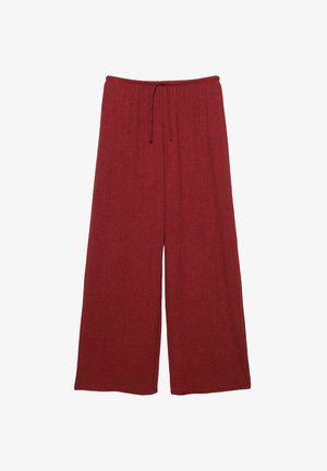 Široke hlače v temno rdeči barvi, narejene iz teksturirane tkanine. Imajo pas z vrvico in sproščen, tekoč silhuet.