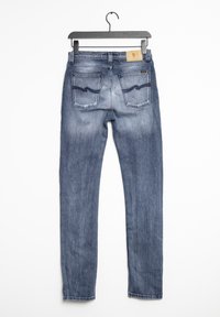 Något tätt sittande blekta blå jeans med en slät yta, fem fickor och kontrasterande sömmar. Har en etikett på midjebandet och en böjd design på bakfickan.