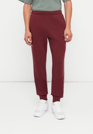 JOGGER - Pantalon de survêtement - dark red/white