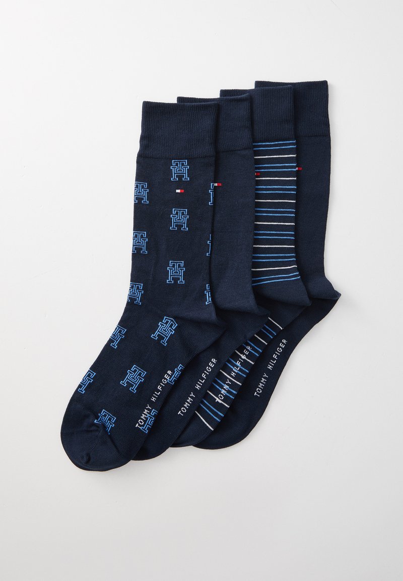 Vier Paare marineblauer Socken mit blauen Logo-Mustern, Streifen und strukturiertem Material. Mit Branding am Bund.