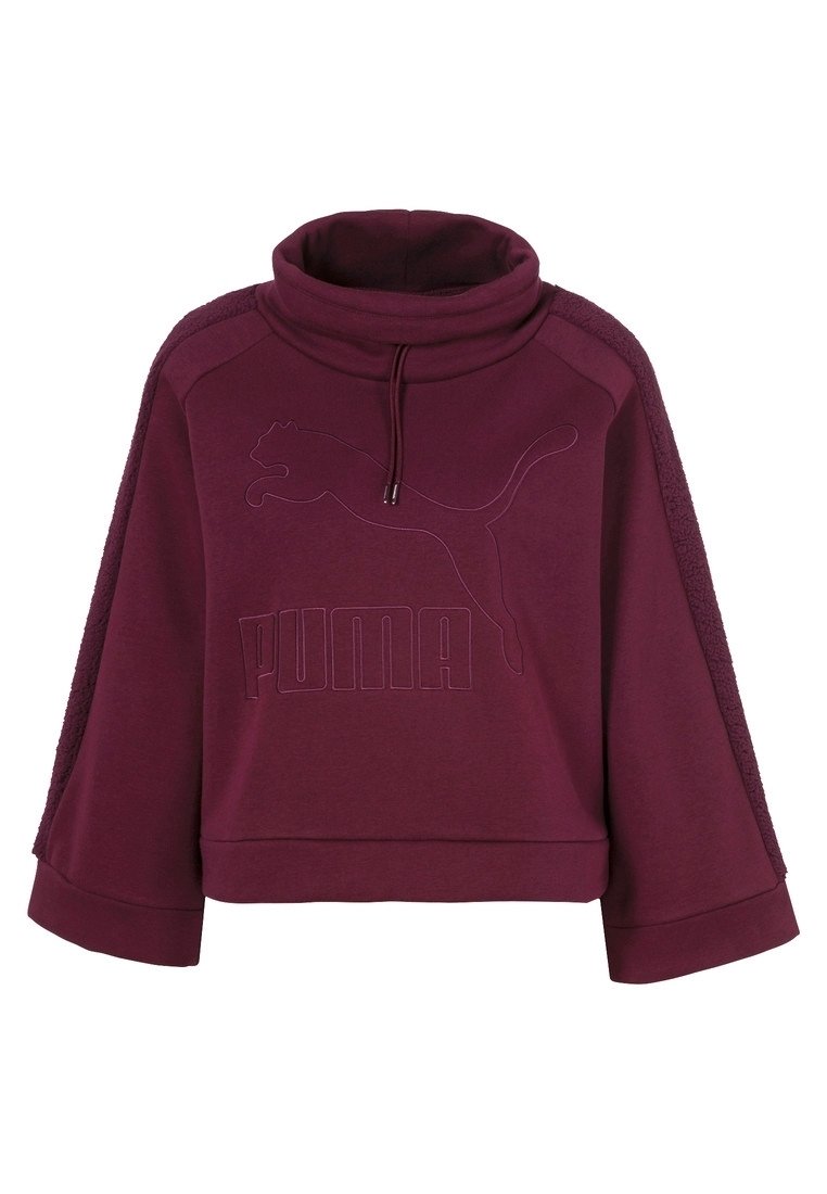 Sudadera burgundy corta con cuello alto, mangas anchas, logo en relieve y paneles laterales texturizados. Fabricada con tejido suave.