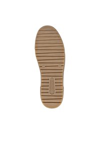 Suola di scarpa realizzata in gomma testurizzata, caratterizzata da scanalature orizzontali, forma arrotondata e colore beige con una leggera impressione del logo.