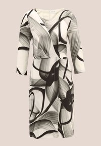 Schwarz-weißes Kleid mit abstraktem Wirbelmuster. Lange Ärmel, Wickeldesign, glatter Stoff, knielang, mit einem dezenten Knotendetail in der Taille.