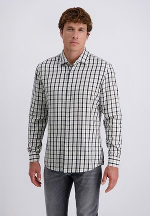 Camicia a maniche lunghe a scacchi bianca, verde e blu navy. Presenta un colletto a camicia e un orlo dritto. Realizzata in tessuto tessuto.