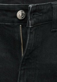 Black denim pants with a visible zipper and metal button closure. Features a classic fit and subtle stitching. Smooth texture.
