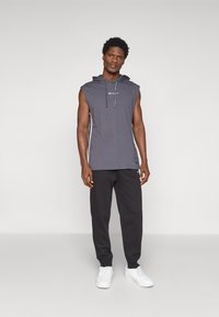 Champion ICONS CUFF PANTS - Jogginghose - black