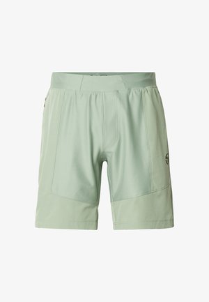 Világoszöld sportnadrág széles derékrésszel, elülső varrási részletekkel és kis logóval a bal alsó lábszáron.