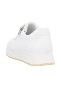 White sneaker with a smooth leather upper. Features a zipper accent on the side and a lightweight cream rubber sole. Clean, rounded design.