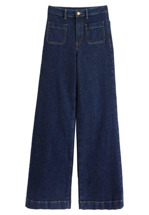 Breda jeans i mörk indigoblå, med hög midja, fem fickor och synlig sömnad längs sömmarna och fållen.