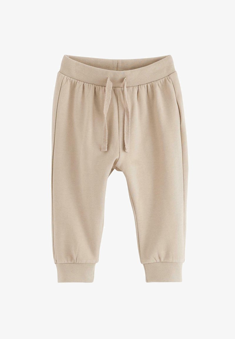 Beżowe dresy z elastycznym paskiem i sznurkiem do regulacji, z prążkowanymi mankietami i miękką teksturą. Kieszenie po bokach dla wygody.