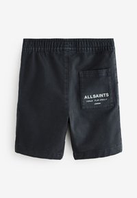 Čierne bavlnené šortky s elastickým pásom, vybavené jedným zadným vreckom a bielym značeným textom. Jednofarebné s hladkou textúrou.