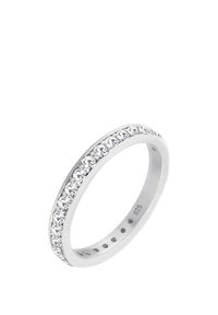 Anneau bande en argent 925 sterling, orné d'une rangée de pierres de zirconium cubique claires et rondes le long du bord supérieur.