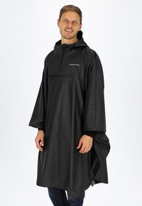 Svart vattentålig poncho med huva, med en framficka med dragkedja och en lös passform, gjord av ett slätt och lätt material.