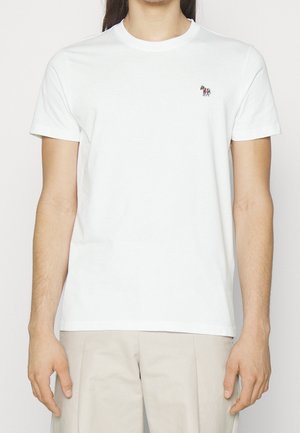 Biała bawełniana koszulka z okrągłym dekoltem, krótki rękaw, z małym, kolorowym logo konia na lewej stronie klatki piersiowej.