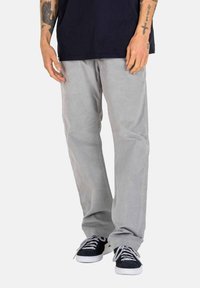 Light gray pants with a relaxed fit, made of soft fabric, featuring a smooth texture, side pockets, and subtle stitching details.