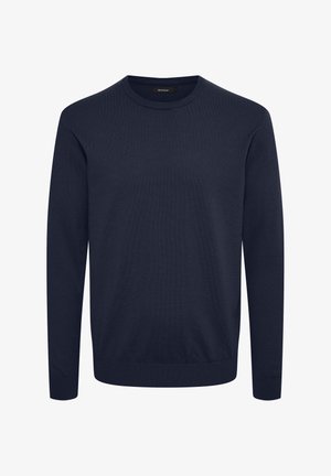 Pull en maille bleu marine avec un col rond, des manches longues et un ourlet côtelé. Le tissu semble lisse avec un design simple et uni.