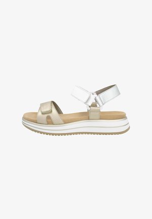 Wedge sandal with a textured gold leather upper, white adjustable strap, and tan cushioned footbed. Features white and beige layered sole.