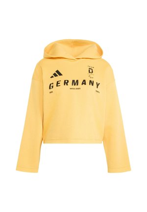 Żółta krótka bluza z miękkiego materiału z nadrukiem z przodu. Posiada kaptur ze sznurkiem i długie rękawy. Czarny tekst i akcenty z logo.