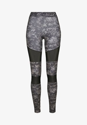 Hallitusseente mustriga leggingud, millel on võrgupaneelid, sobiv disain ja kõrge vöökoht, valmistatud venivast ja tekstuuritud materjalist.