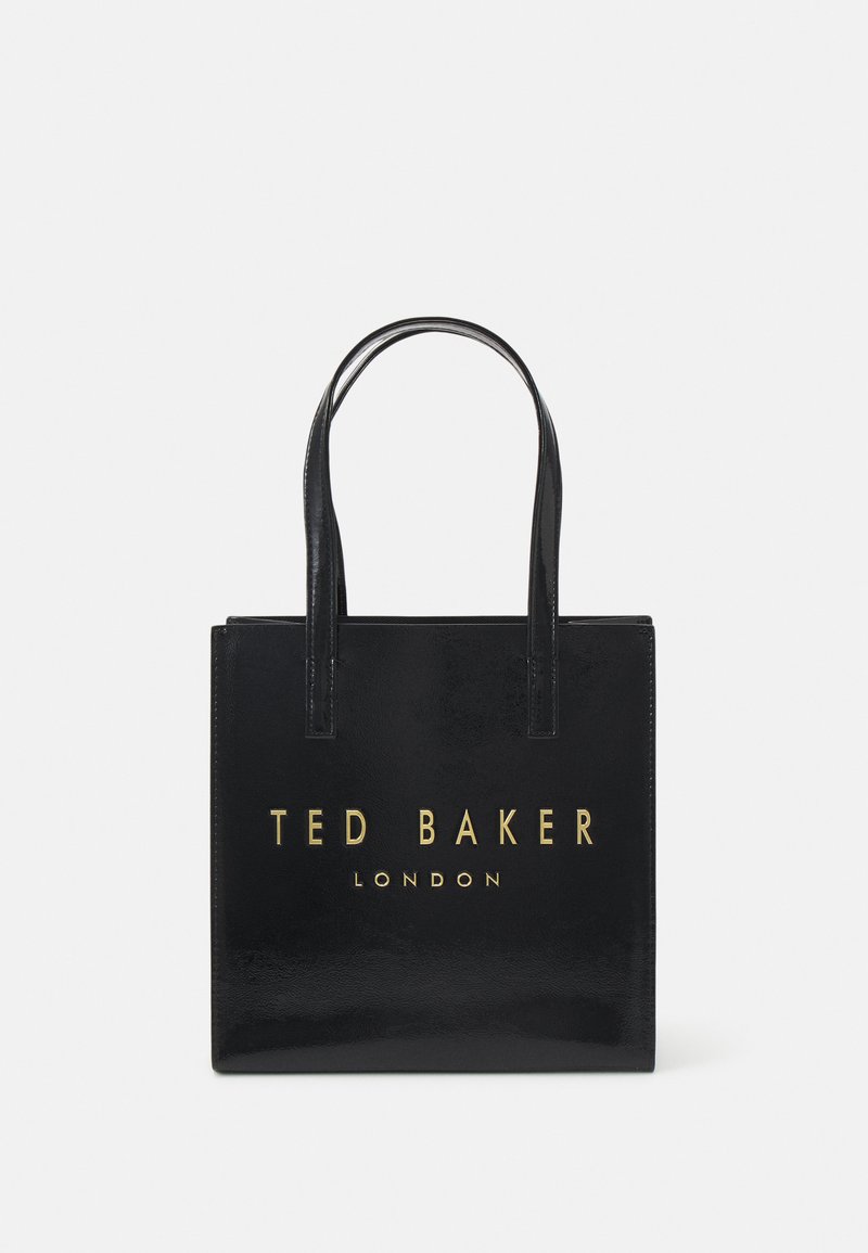 Juodas odinis tote krepšys su blizgiu paviršiumi. Auksinis "TED BAKER LONDON" logotipas priekyje. Turintis dvi rankenas ir stačiakampio formą.