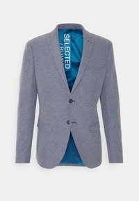 Blå texturerad kavaj för män med två knappar, slagkrage, fickor med klaff och blå satinfoder som visar texten "SELECTED / HOMME" inuti.