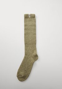 Calzino fino al ginocchio di colore verde oliva con un motivo a maglia testurizzata; presenta una punta rinforzata e un risvolto con il logo "UGG".