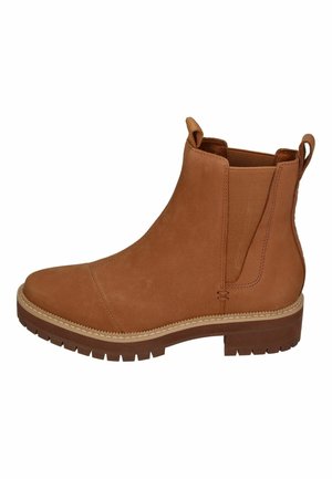 Bruine leren enkelboots met elastische zijkanten, trekzolen bij de kraag en een rubberen zool met profiel.