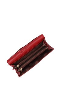 Red leather wallet with a smooth texture. Interior features a brown lining with polka dots and two zippered compartments for organization.