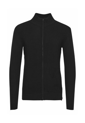 Sweatshirt noir avec zip, texture côtelée, col montant, manches longues et taille ajustée. Il possède une fermeture éclair lisse et une couleur unie.